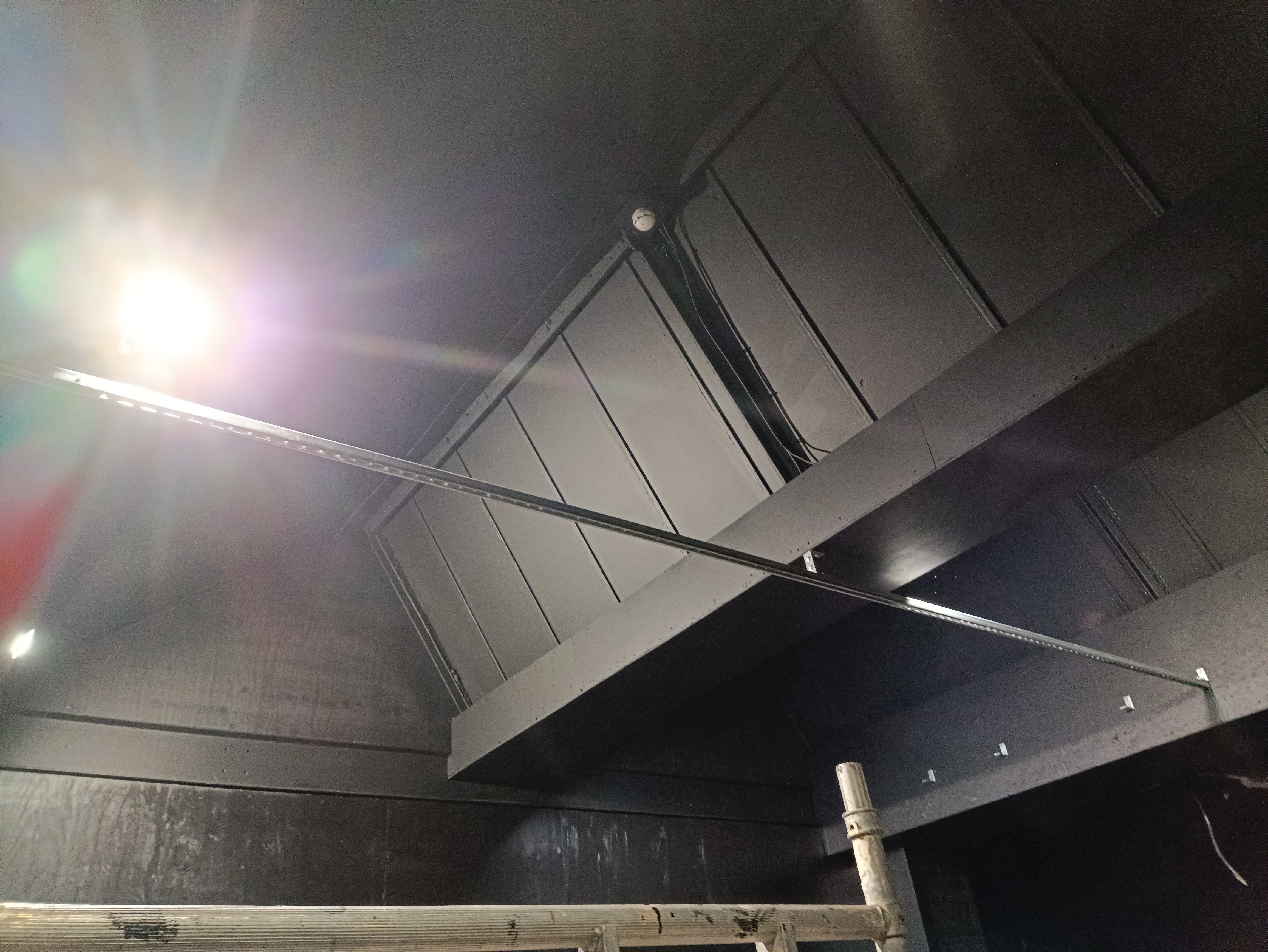 Unistrut support system being installed for suspended LED lighting in a gym
