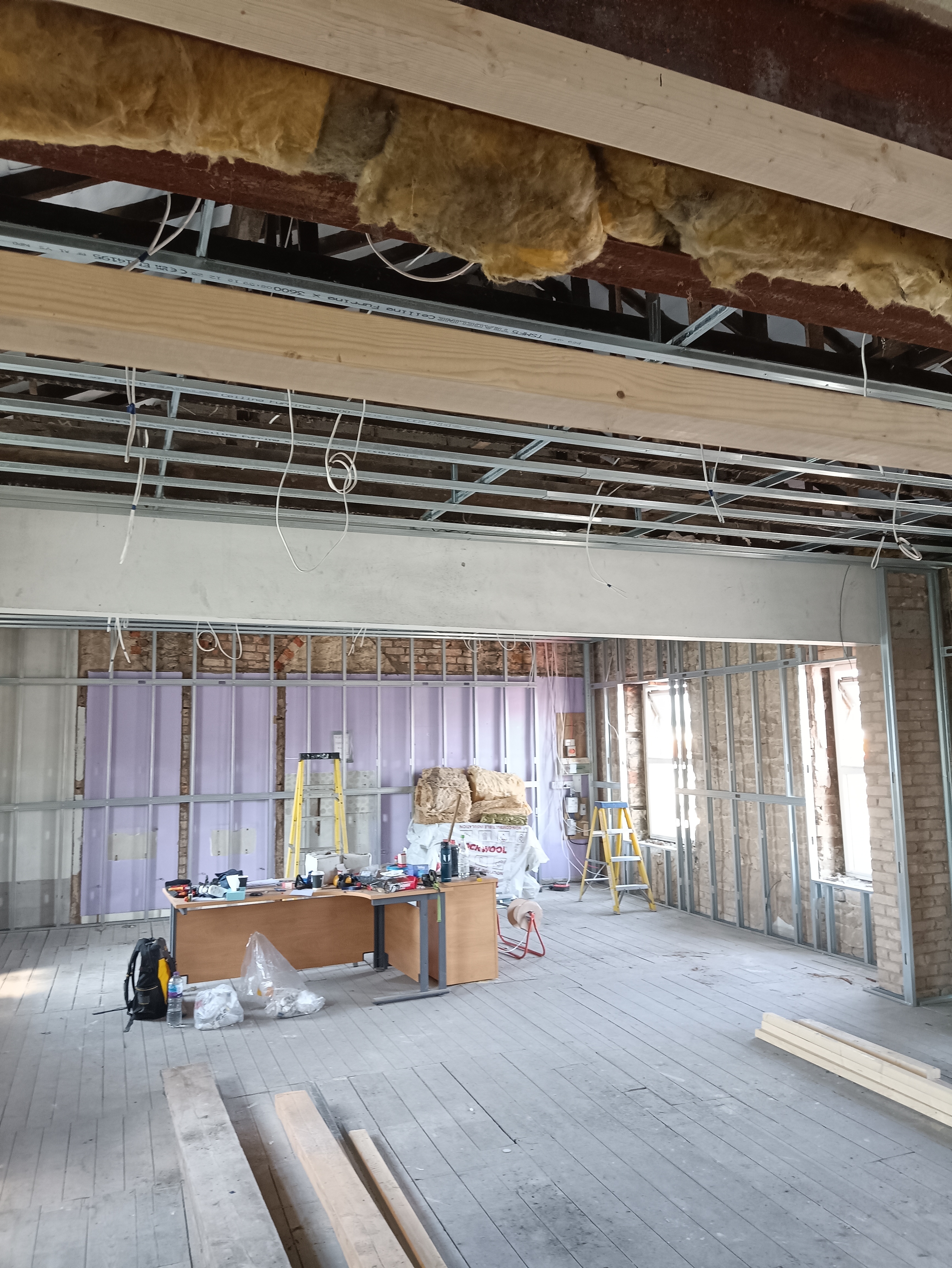 First-fix electrical installation underway inside the Pilates studio